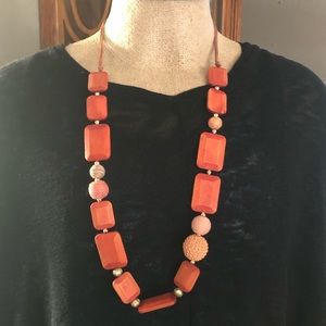 Chico’s orange wood , cord mixed media necklace.